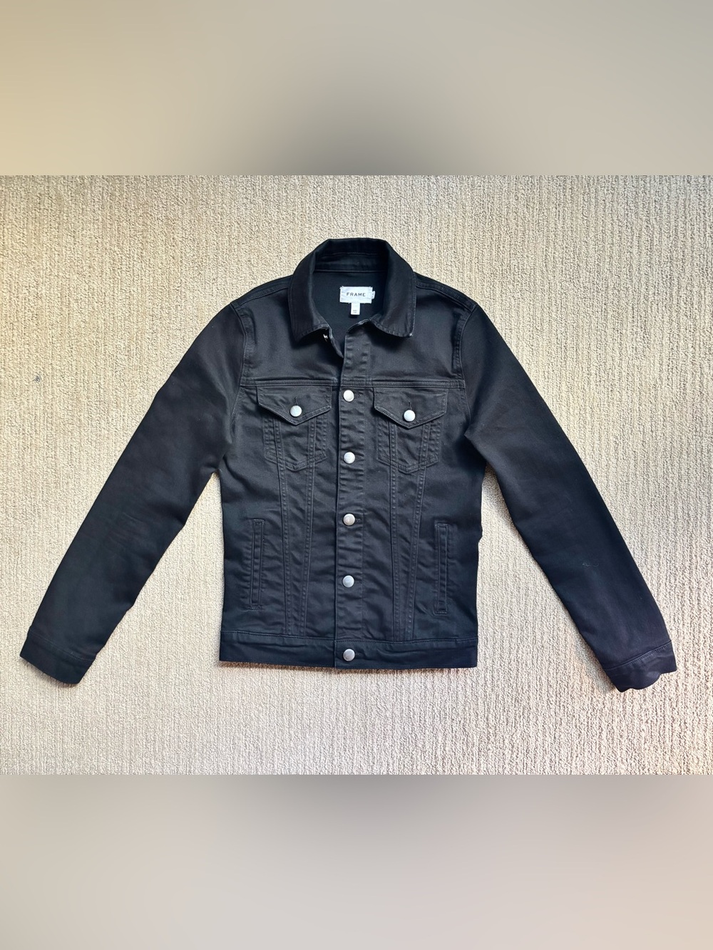 frame — black denim trucker jacket